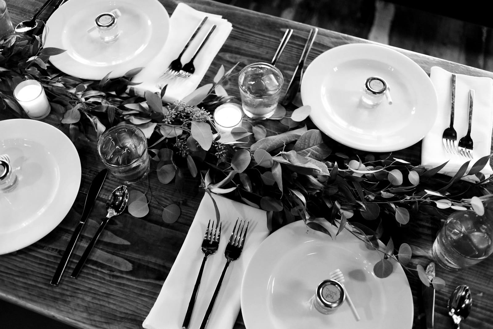 Place setting with a greenery table runner