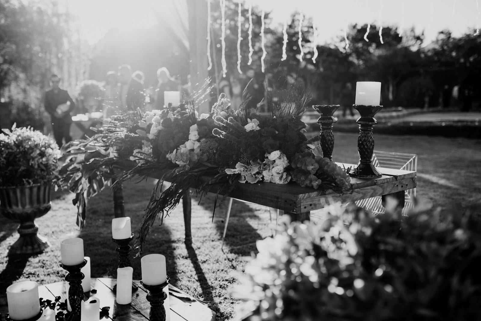Outdoor table styled with florals and candles
